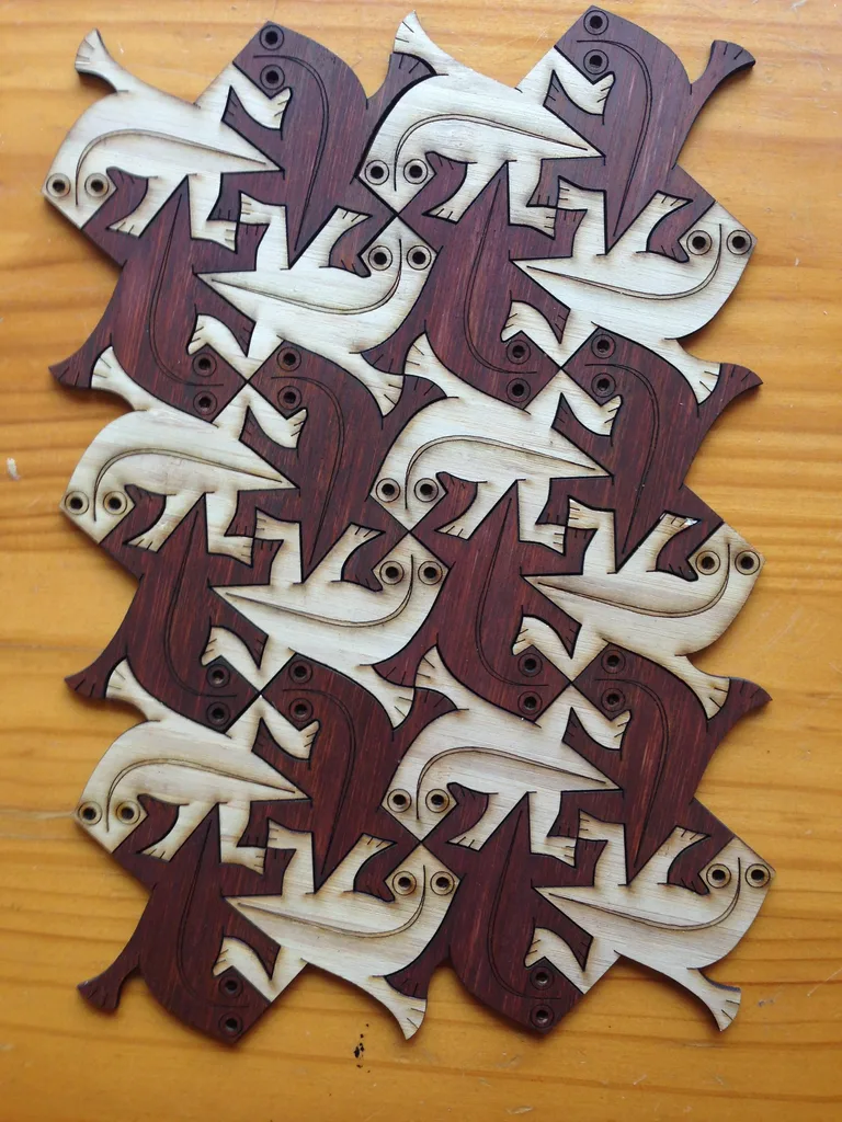 Laser-cut geckos, inspired by MC Escher